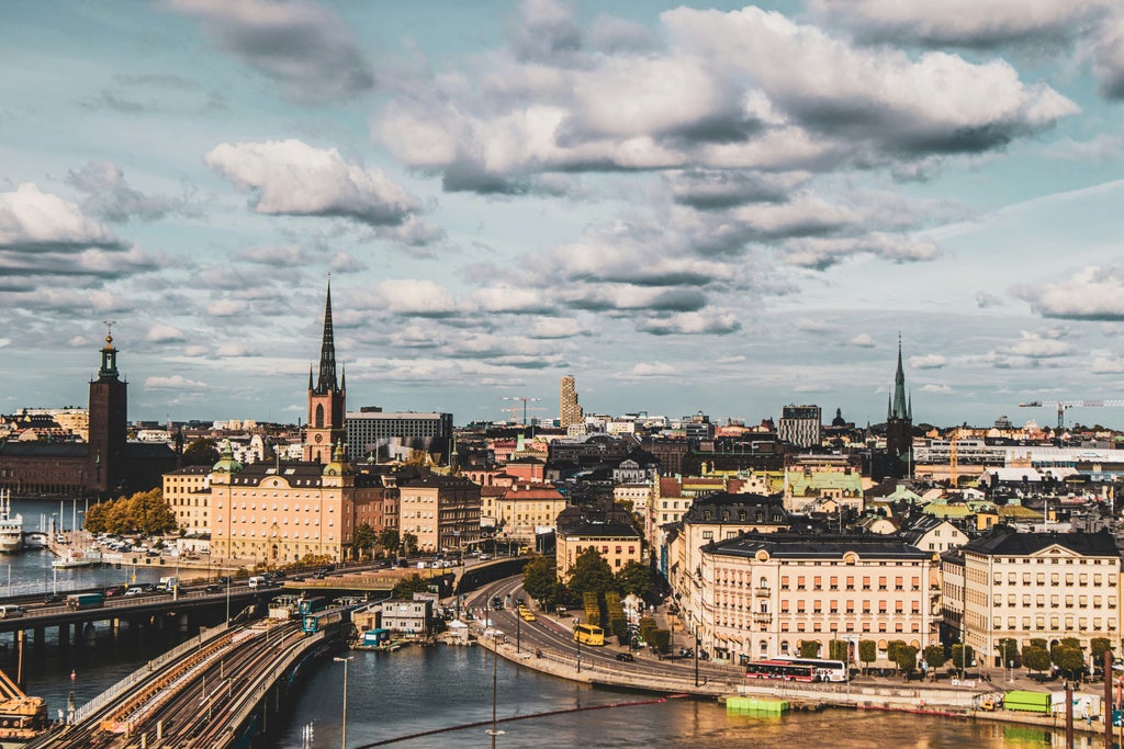 Elegant Stockholm city skyline with historic Old Town, royal palace, and modern waterfront, showcasing vibrant urban architecture and scenic Nordic landscapes