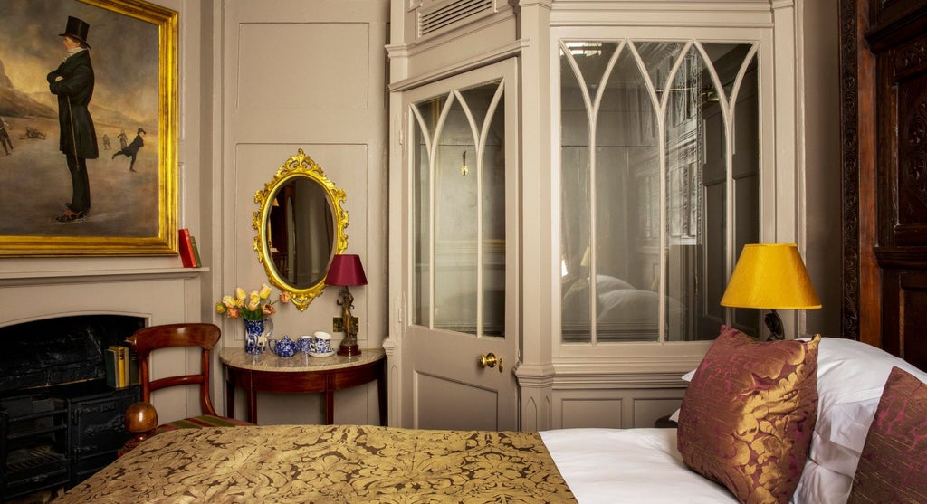 Elegant Regency-style club double room with dark wood furnishings, plush bedding, and sophisticated vintage decor in a classic United Kingdom hotel setting