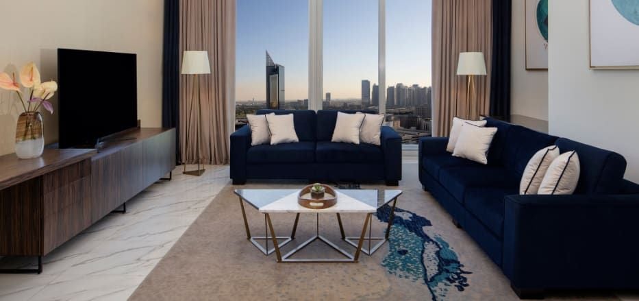 Spacious two-bedroom apartment with modern furnishings, panoramic city views, sleek design, and luxurious Dubai hospitality at Scenset+ Palm View Hotel & Suites