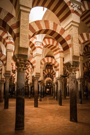 Mesmerizing forest of over 850 red and white striped columns.
