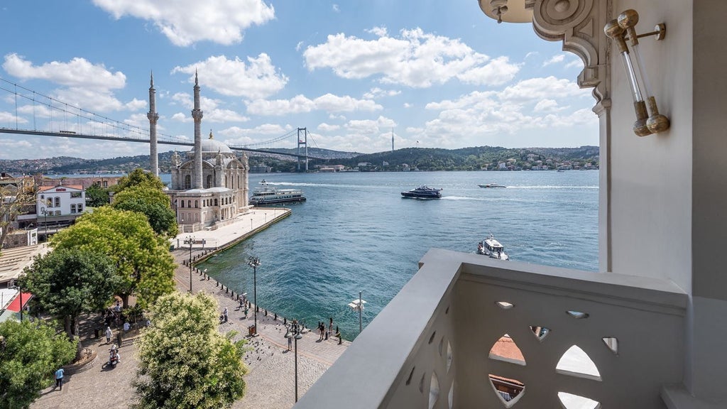 Luxurious executive suite with panoramic Bosphorus views, contemporary design, king bed, floor-to-ceiling windows, and elegant modern Turkish interior styling