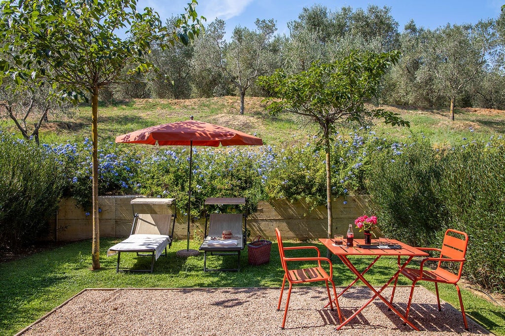 Elegant Italian executive junior suite with rustic stone walls, plush white bedding, wooden furnishings, and warm natural lighting in Tuscan countryside