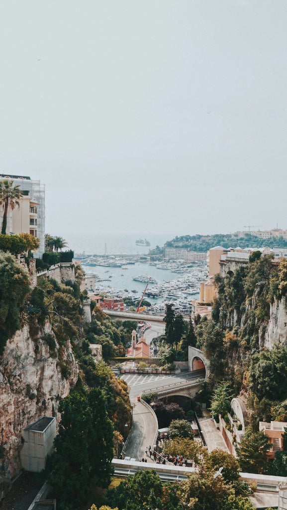 Luxurious Monaco day tour featuring Monte Carlo's iconic casino, yacht-lined harbor, and elegant Monte-Carlo streets with pristine Mediterranean backdrop