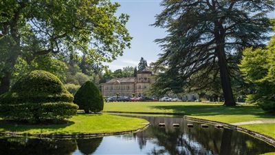 Luxurious Grantley Hall, a restored Georgian manor nestled in lush Yorkshire countryside, showcasing elegant architecture and manicured gardens.