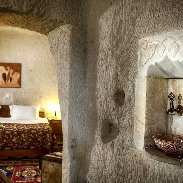 Luxurious deluxe room in Museum Hotel with elegant furnishings, traditional Turkish design, and soft neutral color palette with artistic décor elements