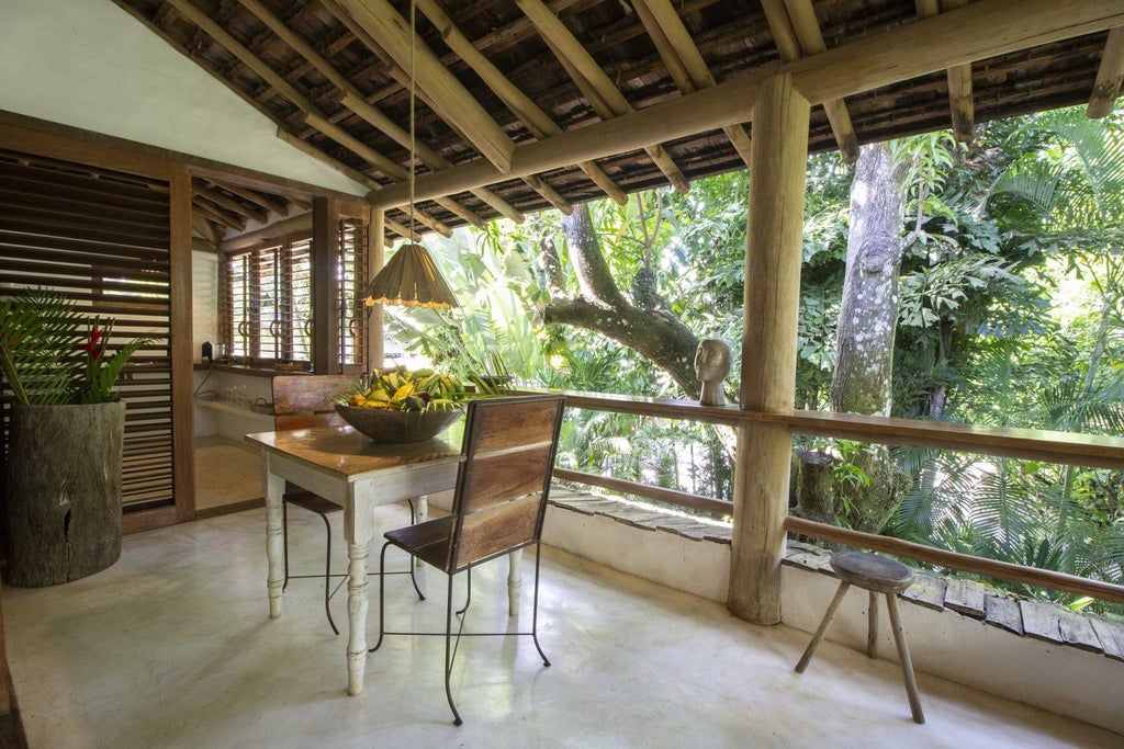 Rustic wooden-beamed suite with lush tropical plants, handcrafted local furniture, and soft natural lighting in Brazilian eco-luxury resort setting