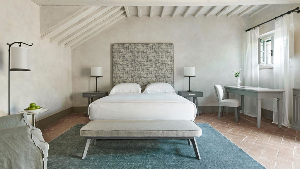 Elegant Italian hotel room with antique wooden beams, crystal chandelier, plush king bed and panoramic Tuscan countryside views