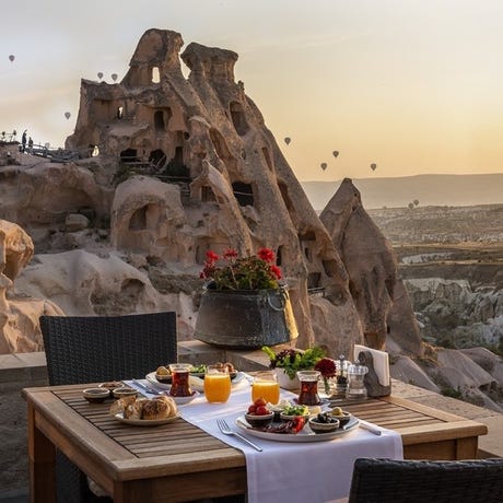 Enjoy a delicious Turkish breakfast as you watch the hot air balloons take flight around you