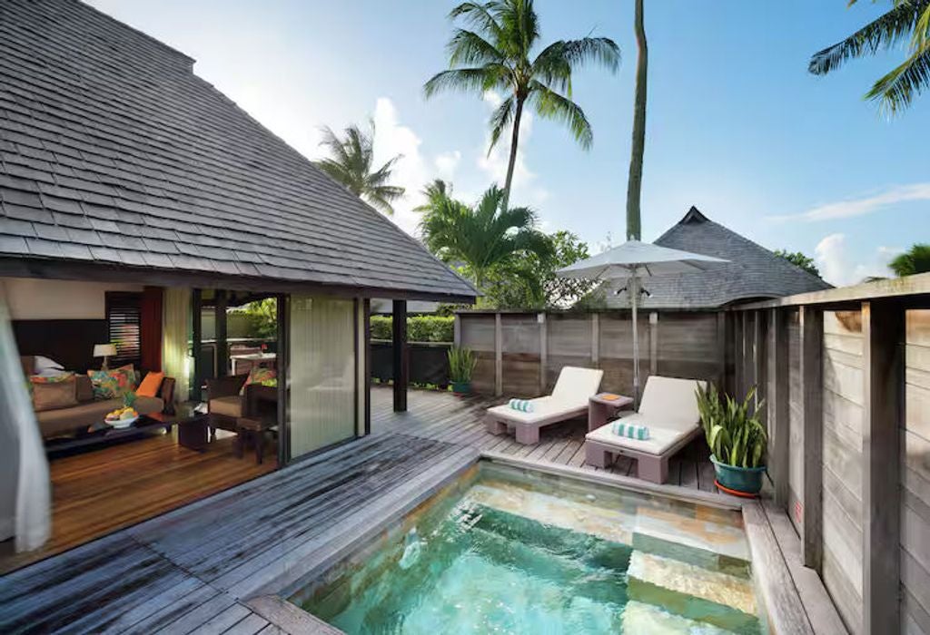 Luxurious twin garden bungalow with private pool, teak wood deck, and tropical landscaping in lush Moorea island setting