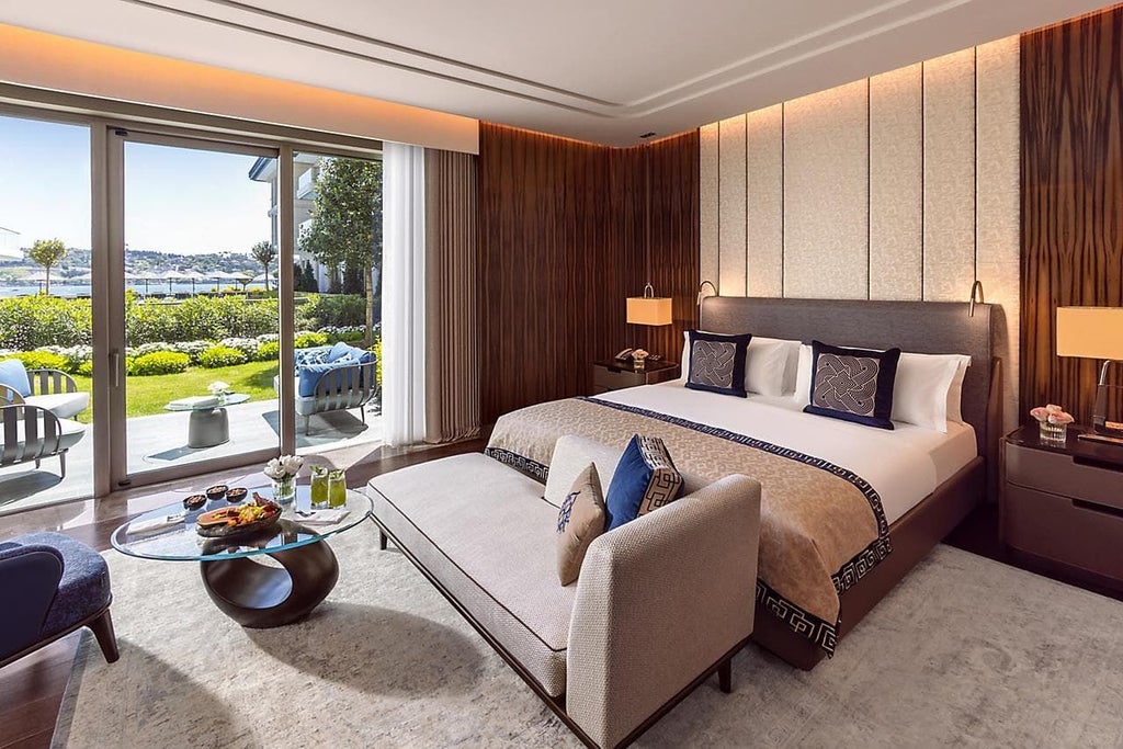 Luxurious Mandarin Room at Mandarin Oriental Bosphorus with plush king bed, elegant contemporary design, and sophisticated neutral color palette overlooking Istanbul's skyline