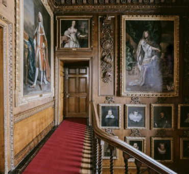 Majestic Blair Castle with stone walls and turrets, nestled in lush Scottish Highlands landscape, showcasing grand baronial architecture and verdant surroundings