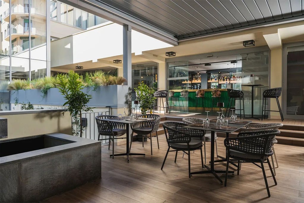 Elegant modern hotel lobby in Florence with sleek contemporary furniture, warm lighting, and minimalist design showcasing Italian architectural sophistication