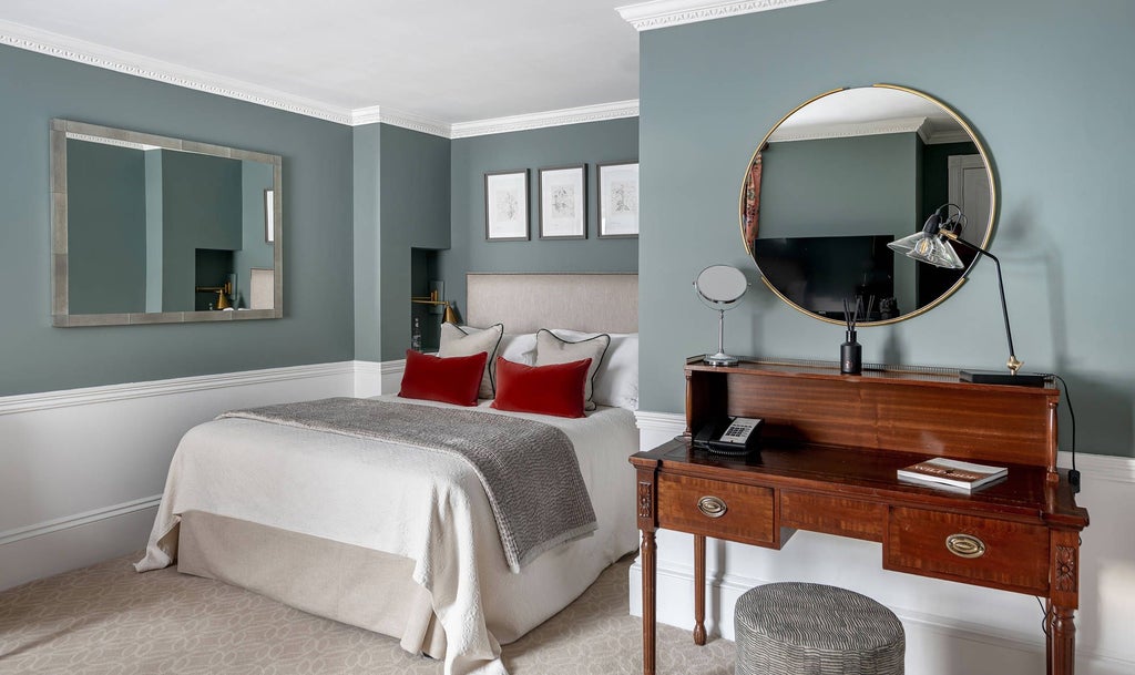 Elegant classic room at Royal Crescent Hotel & Spa, showcasing refined British design with plush bedding, antique furnishings, and soft neutral color palette