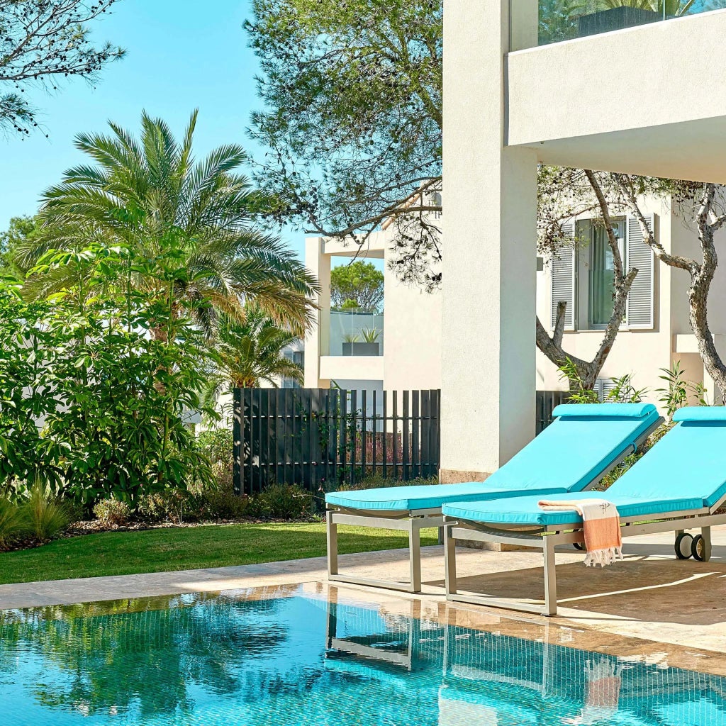 Spacious Garden Pool Suite with two bedrooms, contemporary design, private pool, and stunning Mediterranean views at 7Pines Resort in scenic Ibiza, Spain