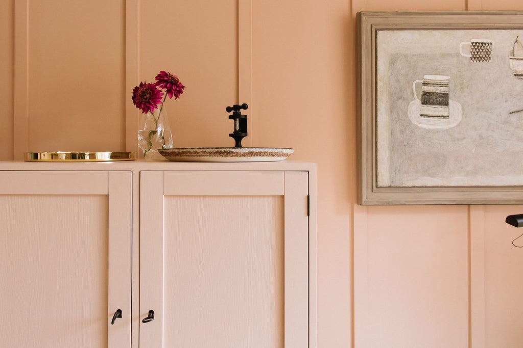 Elegant guest room at Heckfield Place, featuring soft neutral tones, delicate linens, natural light, and refined contemporary British countryside design aesthetic