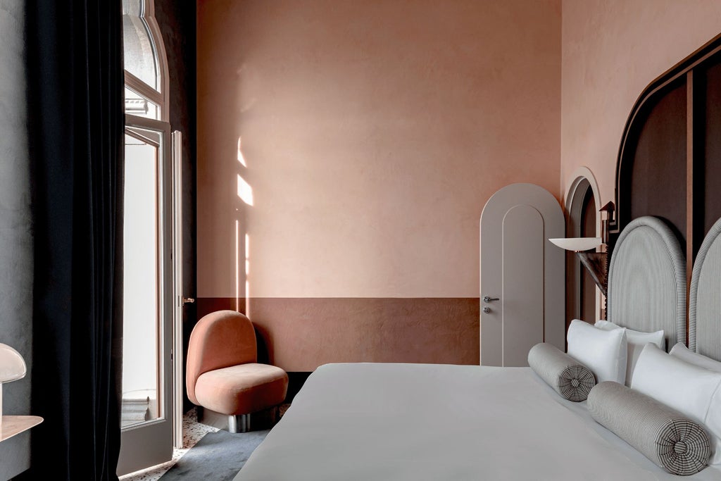 Elegant Venetian hotel room with soft neutral tones, ornate wooden furnishings, arched window overlooking historic canal, luxurious Italian design aesthetic