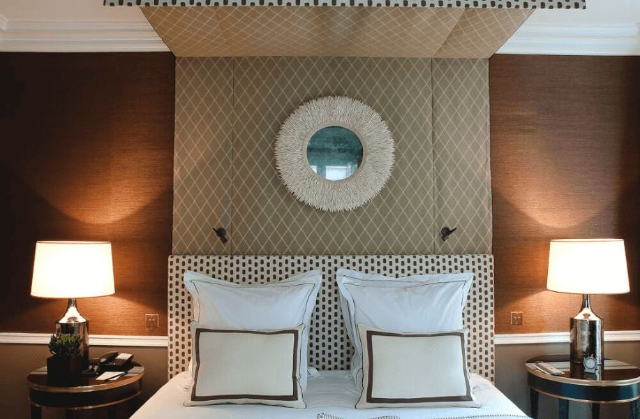 Elegant Club room at Hôtel Récamier in Paris, featuring soft neutral tones, plush bedding, refined contemporary decor with subtle French design elements