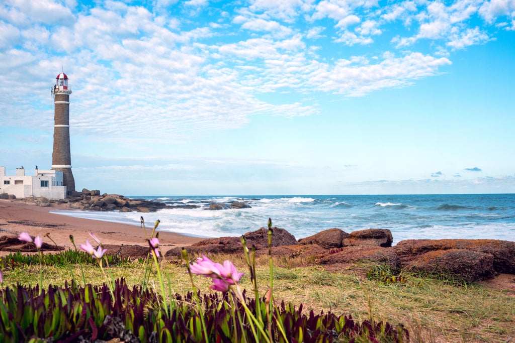 Tranquil beachfront scene in Jose Ignacio, Uruguay, with modern white beach houses nestled among dunes and coastal vegetation