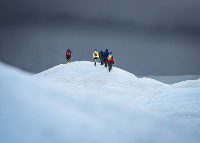 Hikers ascending the Exploradores Glacier