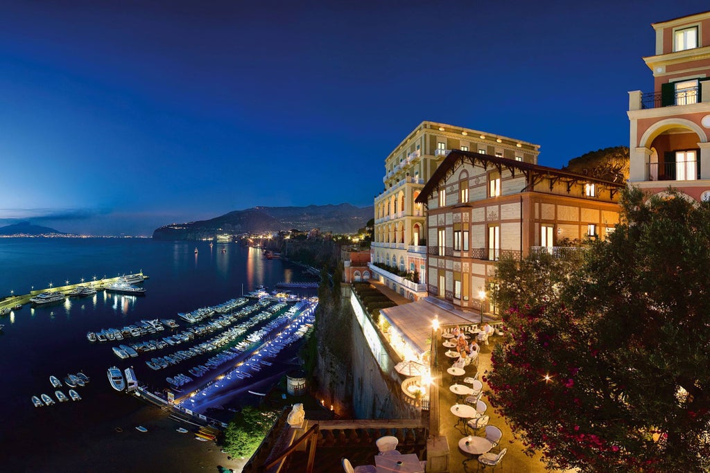 Elegant cliffside hotel in Sorrento with Renaissance architecture, overlooking the Gulf of Naples and lush Mediterranean gardens