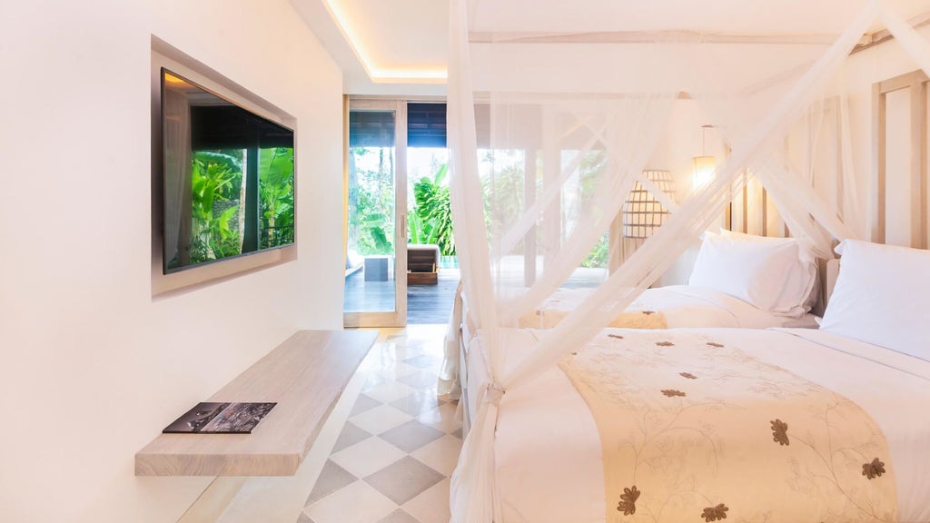 Luxurious villa suite with private plunge pool surrounded by lush Balinese jungle, featuring modern Asian-inspired decor and terrace