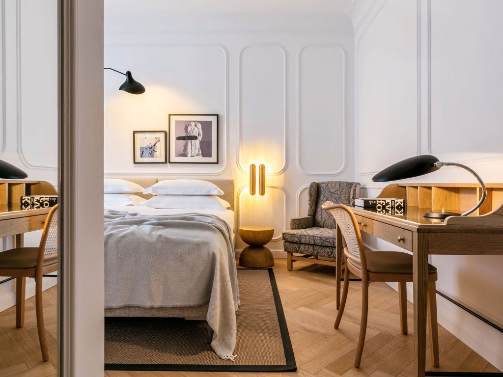 Elegant boutique hotel facade in Split, Croatia featuring ornate stone architecture, wrought-iron balconies and classic European windows