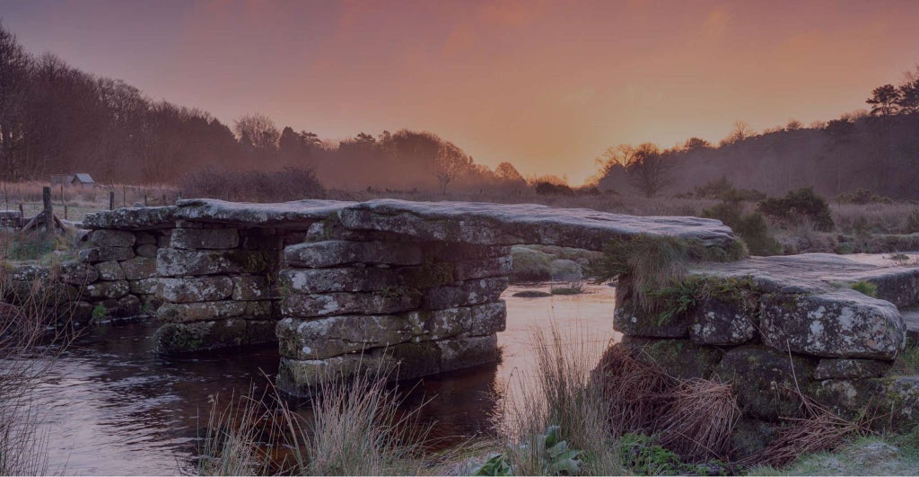 Luxury Scenset Castle Hotel nestled in lush United Kingdom countryside, featuring grand stone architecture, manicured gardens, and elegant exterior at dusk