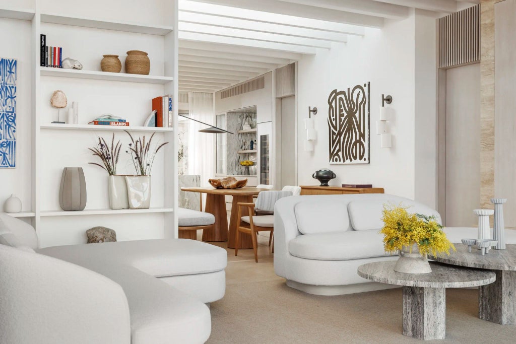 Luxurious Greek villa bedroom with sweeping Aegean Sea views, minimalist white decor, natural wood accents, and floor-to-ceiling windows bathed in golden sunlight