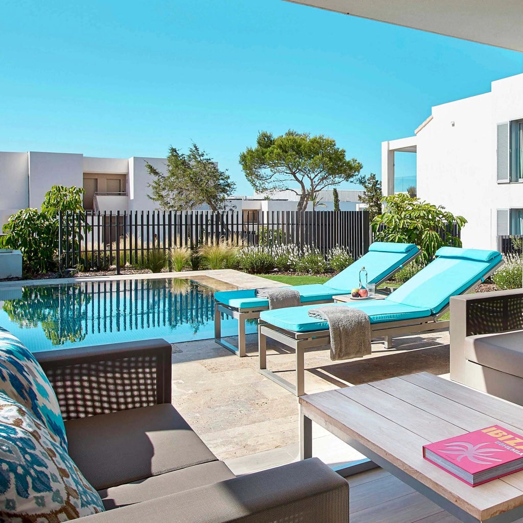 Spacious two-bedroom Garden Pool Suite at 7Pines Resort Ibiza, featuring contemporary design, private pool, and panoramic views of Mediterranean landscape