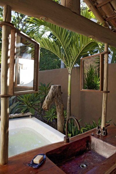 Rustic wooden interior of luxurious Brazilian boutique hotel room with traditional design and natural materials, warm earth tones and elegant minimalist decor