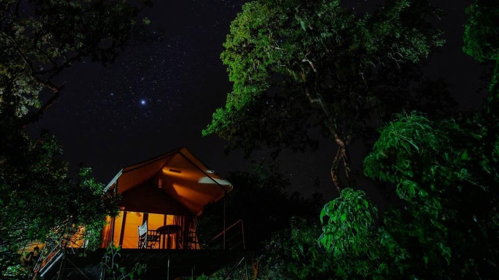 Luxurious eco-lodge nestled in scenic Galapagos highlands, rustic wooden deck overlooking lush landscape with distant volcanic silhouettes