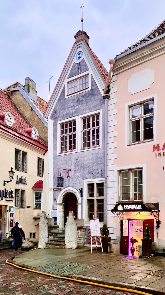 Elegant day trip to Tallinn, capturing medieval Old Town's cobblestone streets, historic towers, and vibrant Nordic urban landscape against soft morning light