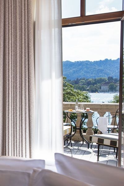 Luxurious Premier Terrace Room with panoramic lake view, elegant contemporary design, and refined Swiss decor at La Réserve Eden au Lac Zurich hotel