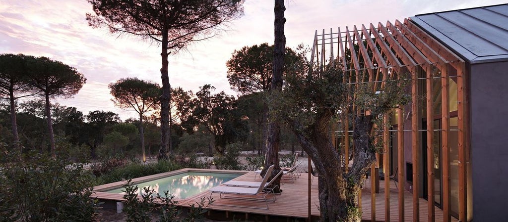 Elegant bio-pool suite at Sublime Comporta Hotel, featuring minimalist design, natural wood tones, and expansive views of Portuguese coastal landscape