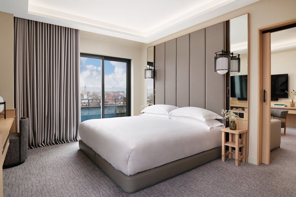 Elegant superior room at Nobu Hotel London Portman Square with contemporary design, plush bedding, and modern minimalist decor in neutral tones