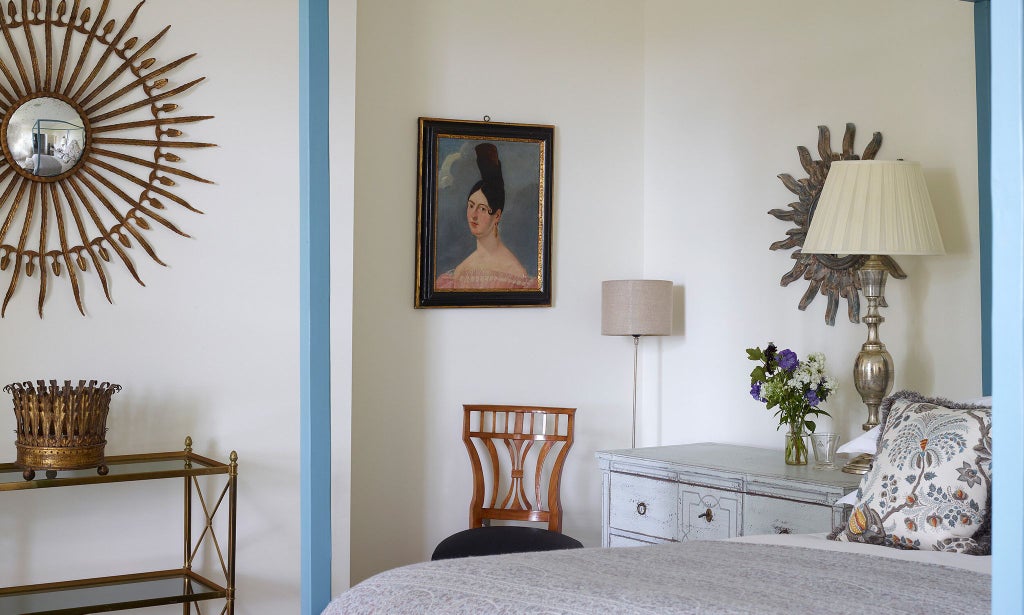 Luxurious hotel room with elegant English Rose decor, soft cedar wood accents, neutral color palette, and plush bedding in a refined United Kingdom setting