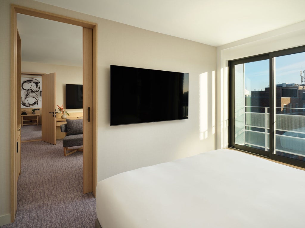 Spacious modern two-bedroom suite at Nobu Hotel London Portman Square with elegant design, plush furnishings, and contemporary minimalist aesthetic