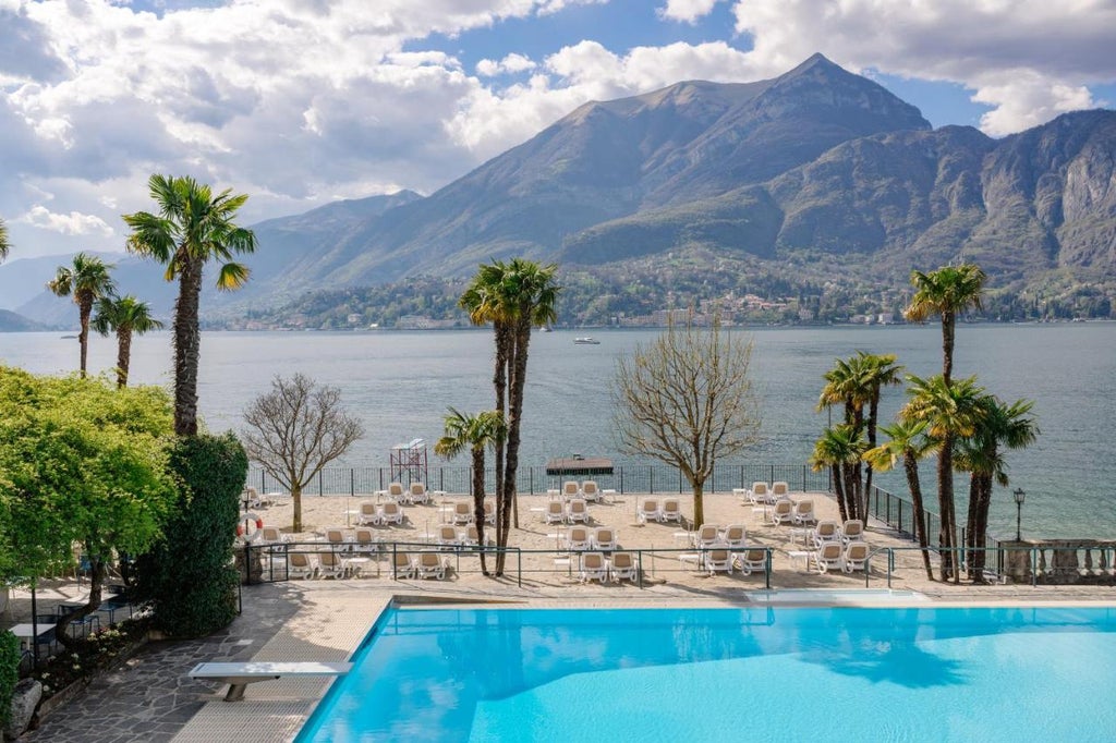 Opulent Italian hotel with ornate Renaissance architecture, grand marble columns, and manicured gardens overlooking Lake Como at sunset