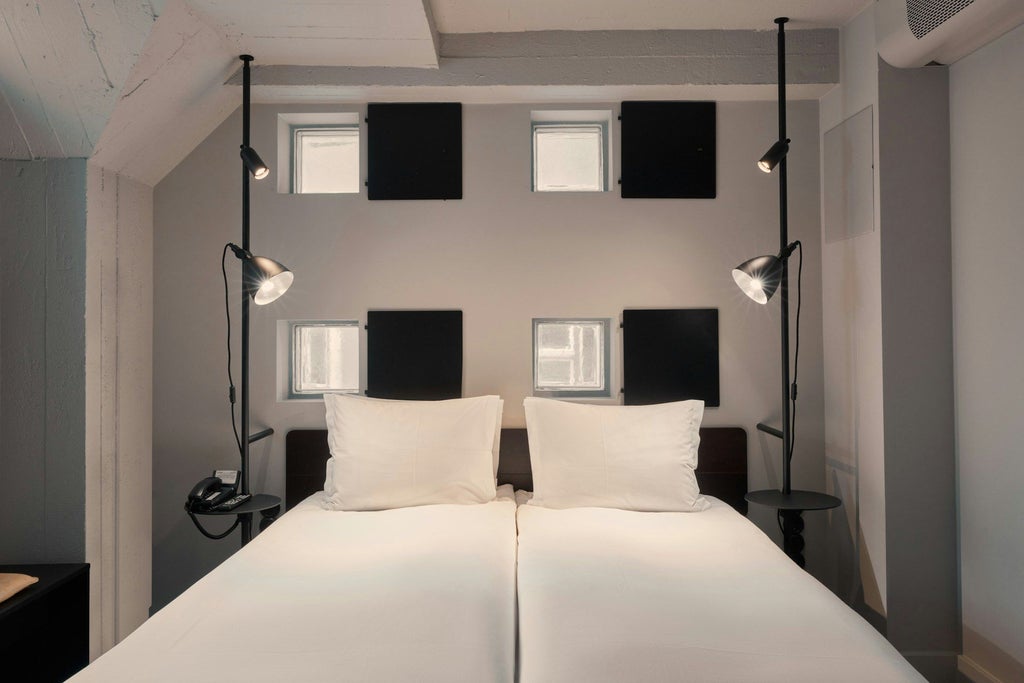 Minimalist Nordic hotel room with sleek design, white bedding, floor-to-ceiling windows, and modern minimalist furniture in a luxe Swedish aesthetic