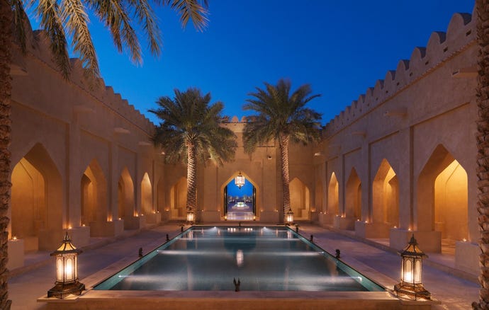 The pool and traditional architecture at Qasr Al Sarab