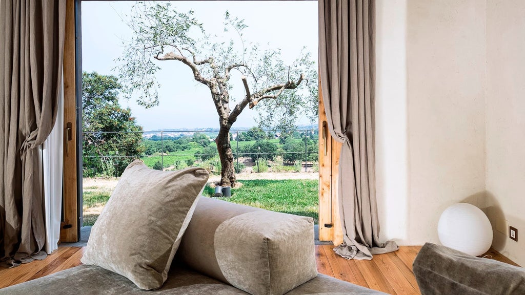 Luxurious two-bedroom pool villa at Monaci delle Terre Nere, featuring elegant design with natural tones, panoramic Sicilian landscape views