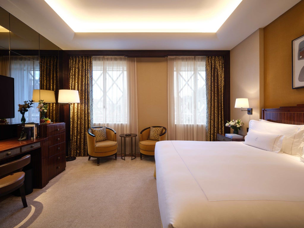 Elegant Premier room at The Scenset Mayfair, featuring luxurious contemporary decor, plush king bed, and refined neutral color palette with city view