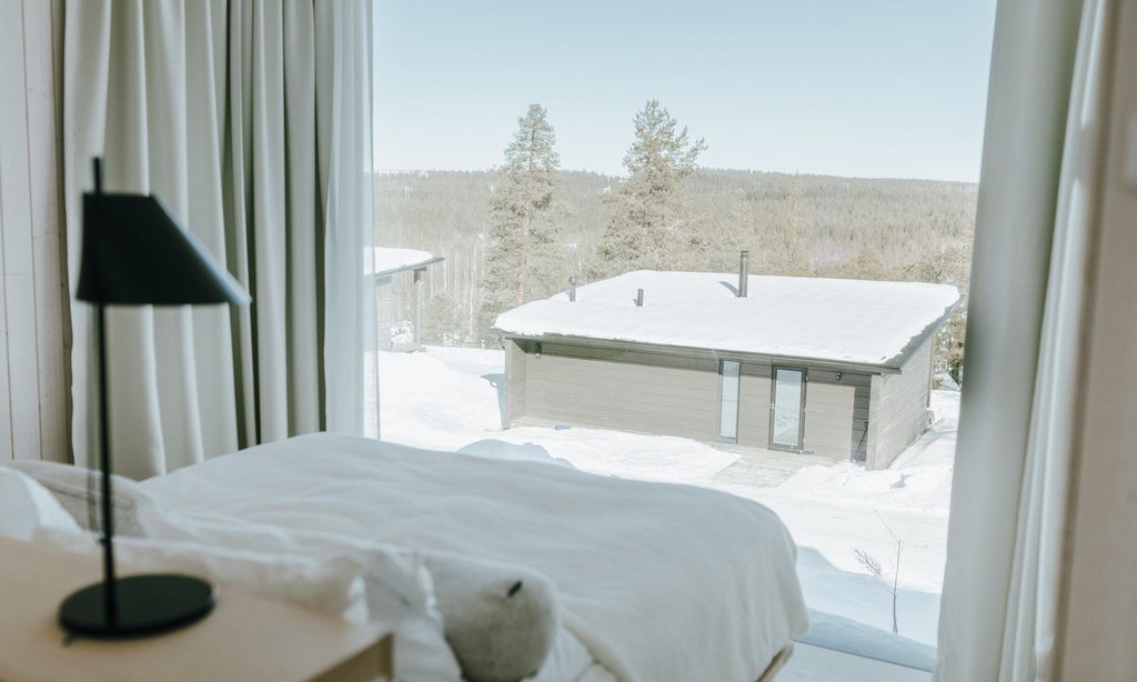 Luxurious executive suite with panoramic windows overlooking snowy Nordic forest, modern minimalist design, warm wood tones, and cozy Arctic ambiance