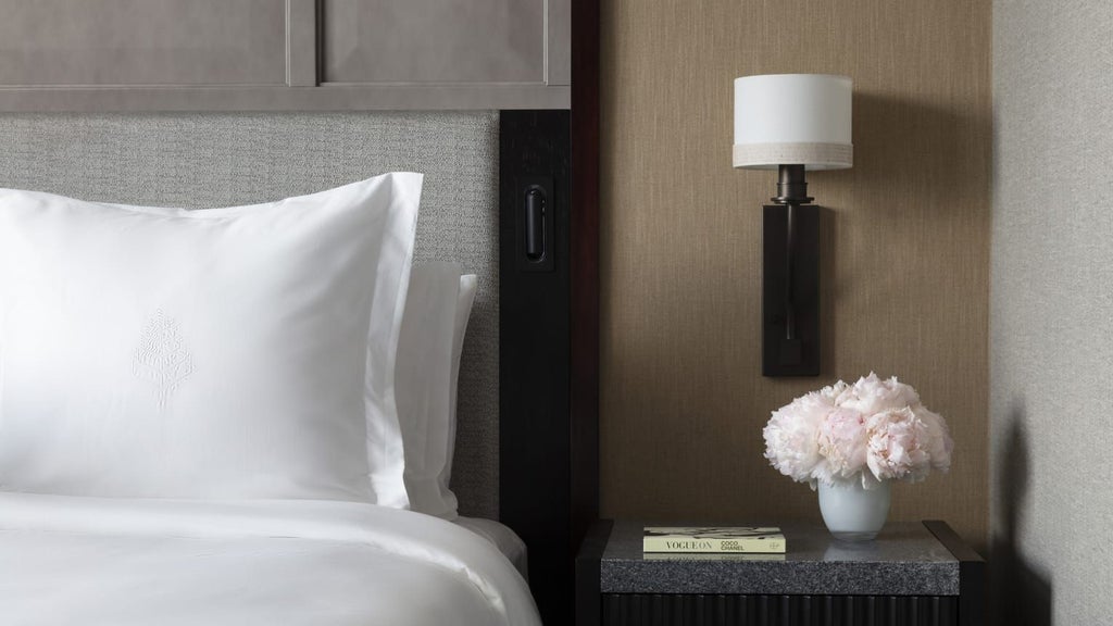 Spacious Premier Accessible Room at Four Seasons Hotel with elegant king bed, plush furnishings, and wide wheelchair-friendly layout in neutral tones