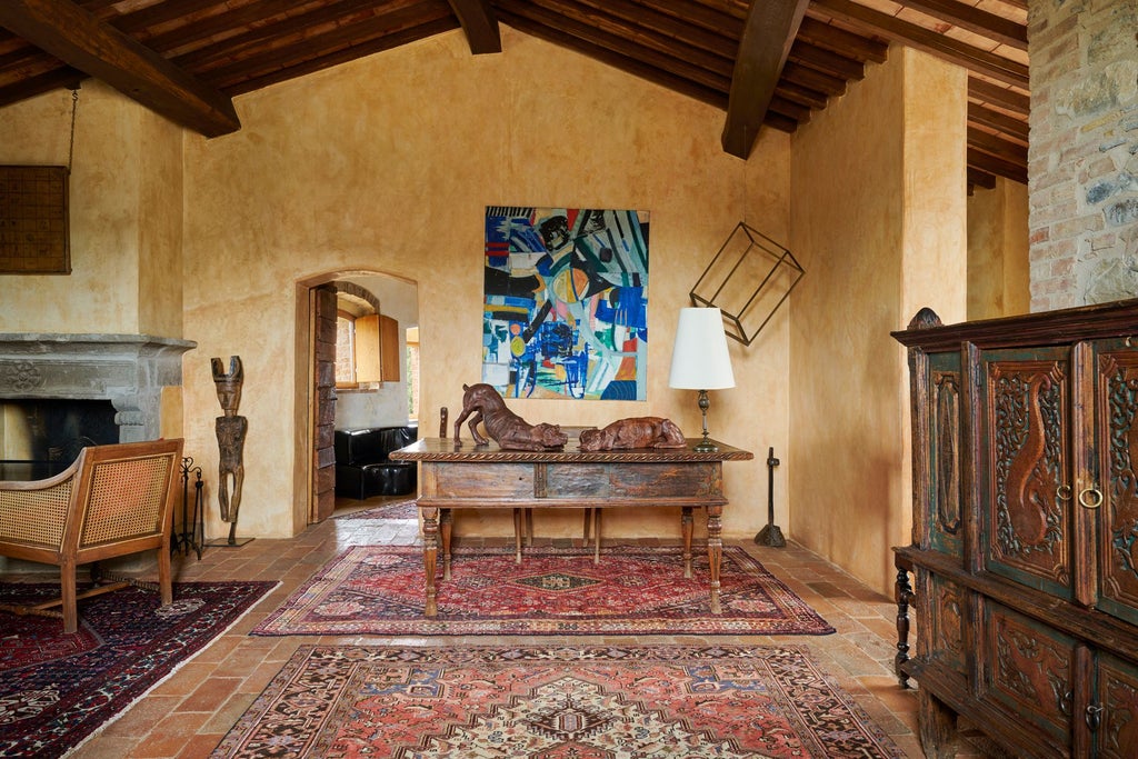 Elegant Tuscan villa bedroom with rustic stone walls, plush white linens, antique wooden furnishings, and panoramic view of rolling Italian countryside