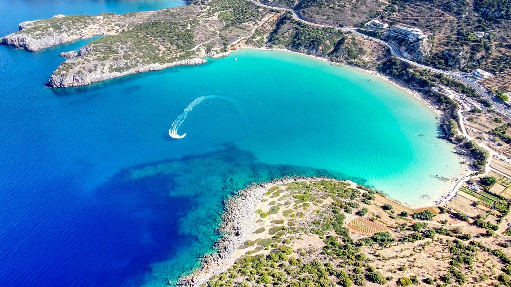 Stunning aerial view of pristine Balos Beach in Crete, turquoise lagoon surrounded by white sand and dramatic limestone cliffs