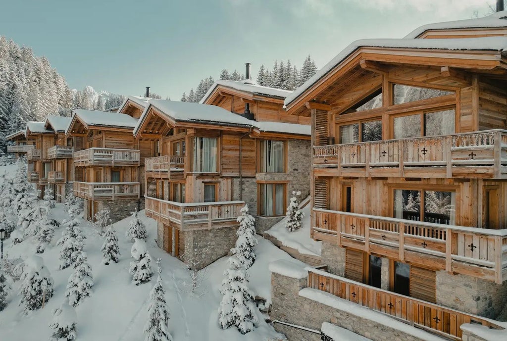 Luxurious ski resort hotel nestled in French Alps, featuring modern alpine architecture with snow-capped mountains and elegant exterior design