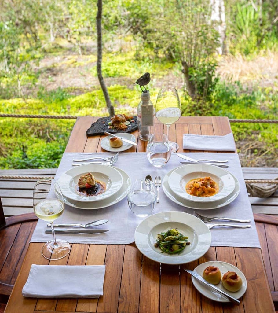 Luxurious safari tent at Galapagos Safari Camp, with canvas walls, wooden floors, and panoramic views of native Ecuadorian wilderness landscape