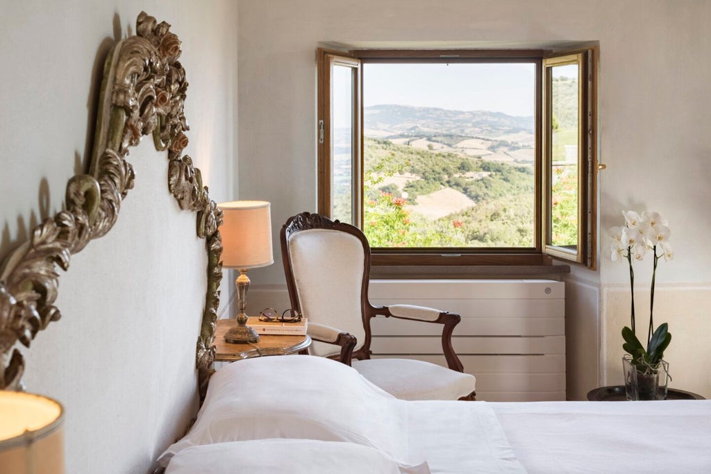 Rustic-chic Tuscan villa suite with exposed wooden beams, elegant antique furnishings, and panoramic countryside views of rolling hills and vineyards.