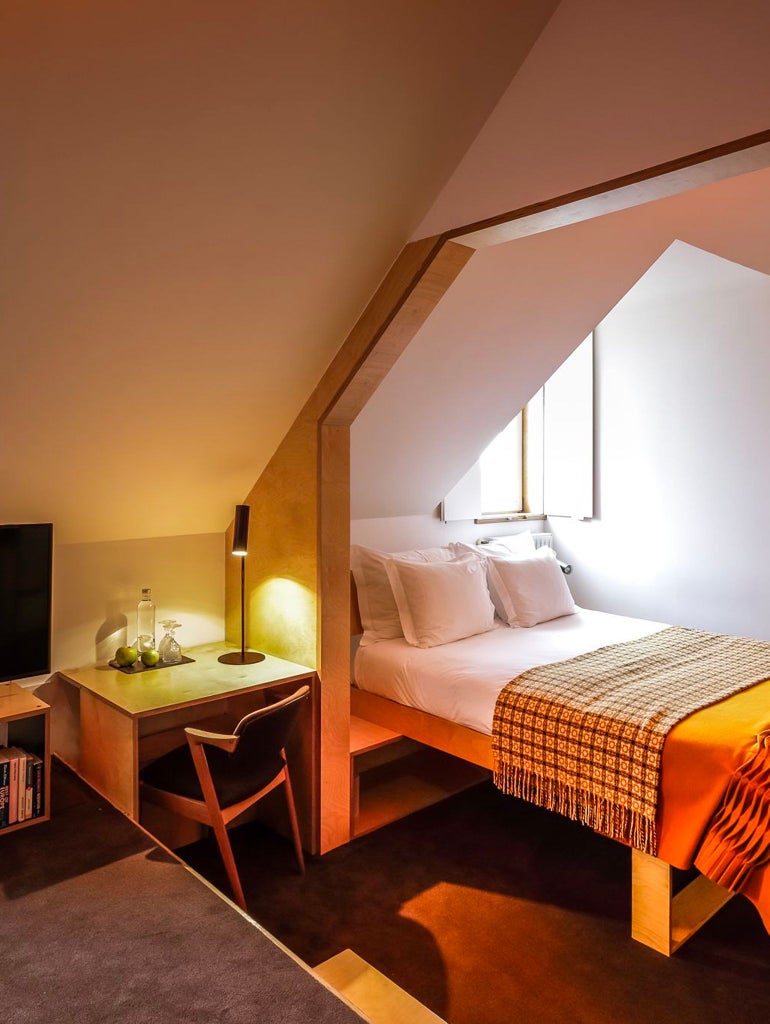 Elegant mountain-view superior double room at Casa das Penhas Douradas with crisp white linens, wooden accents, and minimalist Portuguese design aesthetic